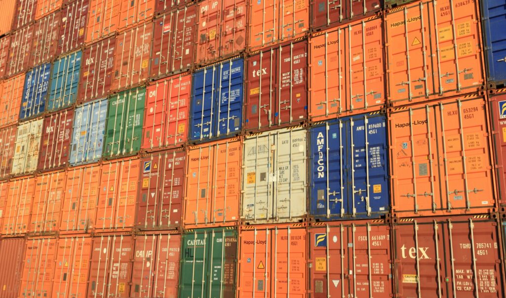 belgium-antwerp-shipping-container-163726-163726 Colorful shipping containers stacked in a harbor, symbolizing global trade.